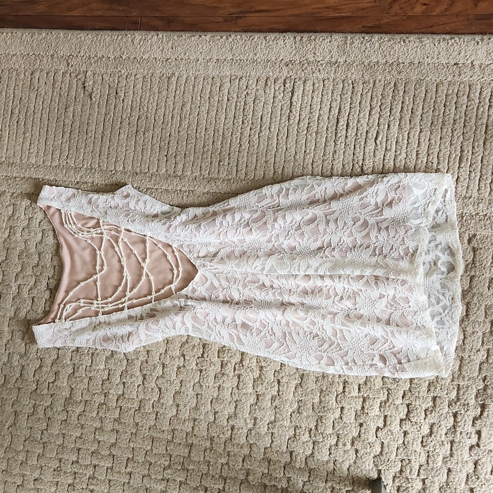 Lace body-con with beaded draped back